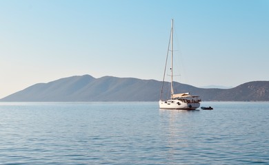Sailing boat on the calm waters of Mediterranean ideal for isolated holidays
