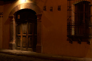 Wooden colonial door lit by warm light