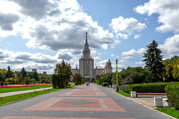 Obraz premium The building of the main higher educational institution in Moscow. Park with tree-lined avenues.