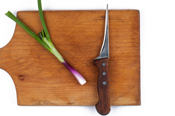 Onion on a cutting board isolated on a white background. Healthy food