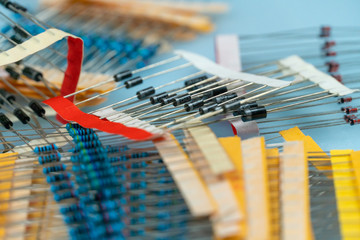 Lots of new electrical resistors close up on a blue background