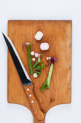 Onion on a cutting board isolated on a white background. Healthy food