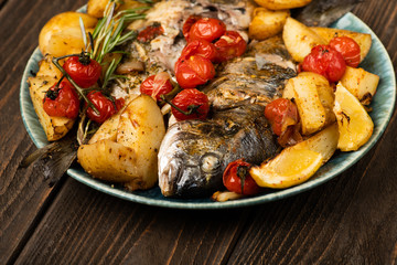 Baked dorado fish served with potato