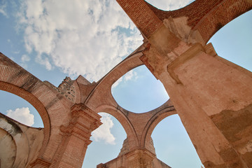 Antigua Guatemala cathedral ruins against blue sky