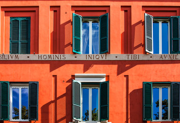 Fototapeta na wymiar Window with shutters on a house facade in Rome Lazio Italy