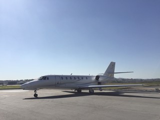 Fototapeta na wymiar Business jet parked in the airport courtyard awaiting passage