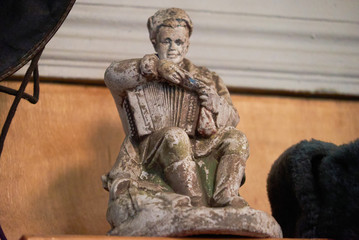 Fototapeta na wymiar gypsum figurine soldier with accordion