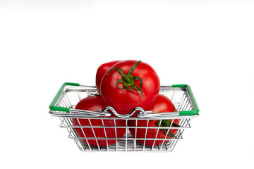 red three fresh tomatoes lie in the store's metal grocery basket on white background