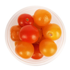 Cherry tomatoes yellow and red in transparent commercial pack