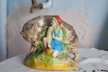 porcelain figurine, little red riding hood and gray wolf, fairy-tale characters.