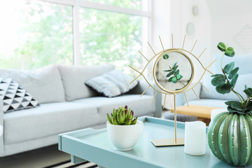 Mirror and decor on table in living room