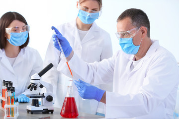 Scientists working in modern laboratory