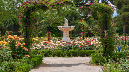 Madrid, Spain, June 01, 2020 : The rose garden fountain in the Retiro park in Madrid