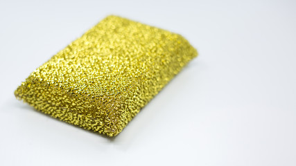 gold kitchen stainless steel spiral scourer pot scraper isolated on white background