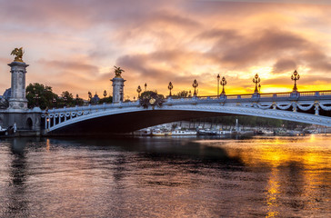 Pont Alexandre III bridge at sunrise in Paris France with a beautiful sky and clouds