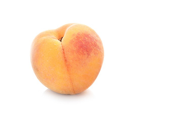 Peach fruit half with leaf isolated on white background