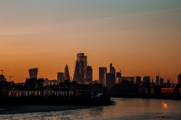 a beautiful sunset in the city of london
