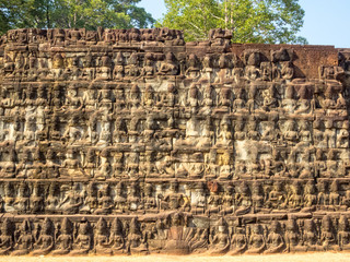 Fototapeta premium The Terrace of the Leper King is a terrace wall with deeply carved nagas, demons and other mythological figures at Angkor Thom, Siem Reap, Cambodia