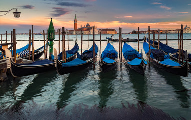 Naklejka premium Gondols at Saint Mark Square, during twilight. Venice, Italy