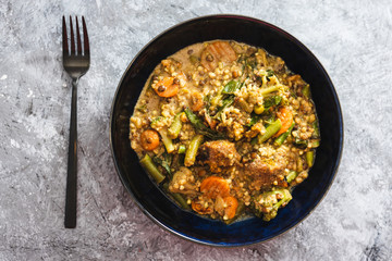 plant-based food, vegan buckwheat stew with carrots green beans and falafels
