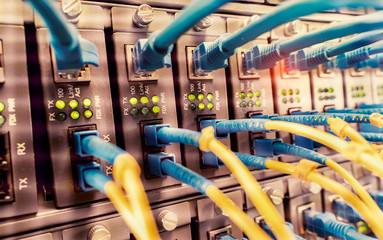 Fiber Optic cables connected to optic ports and UTP, Network cables connected to ethernet ports