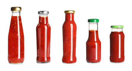 Set with delicious sauces in glass bottles on white background. Banner design