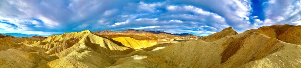Fototapeta na wymiar A feast of colors of yellow and blue at Zabriskie Point