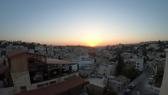 The Amman citadel by the horizon with the sunrise in Jordan