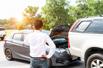 Businessman using smart phone and call the car insurance After traffic Accident