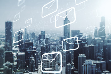 Abstract virtual postal envelopes hologram on Chicago cityscape background, email and notification concept. Multiexposure