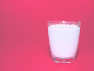 white milk in clear glass on pink background