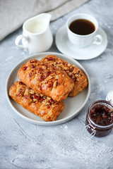 walnut puffs with a cup of coffee and strawberry jam
