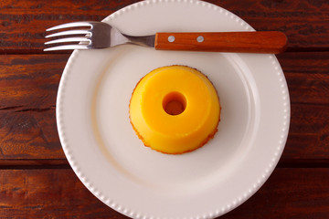 Quindim is a sweet that has as ingredients egg yolk, sugar and grated coconut, very traditional in Brazil