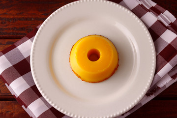 Quindim is a sweet that has as ingredients egg yolk, sugar and grated coconut, very traditional in Brazil