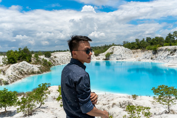 Young man fascinated by the beauty of lead mining site leftovers that evolved into beautiful lake