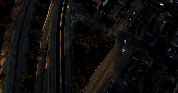 Night time Aerial drone view of Freeway-110 empty with no rush hour traffic during Coronavirus Covid-19 pandemic lockdown in Los Angeles, California, America