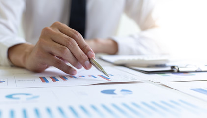 Head of marketing has analyzed the financial income graph of the company in order to develop the structure of the company to be ready for the economy in the future. Financial results analysis concept.