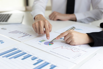 President and the marketing staff of the company convened the earnings revenue and analysis of real estate data graph in the office, Brainstorming ideas about finance and accounting concept.