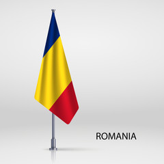 Romania hanging flag on flagpole