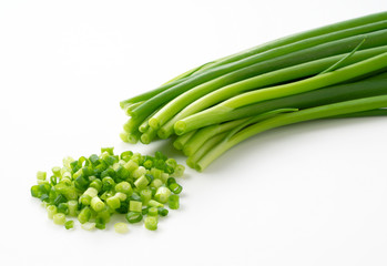 Carved green onions placed on a white background