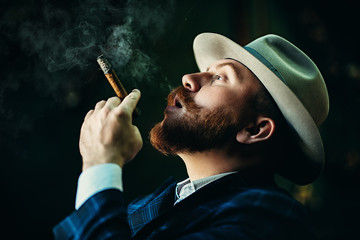 redhead man with cigar