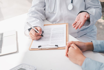 The doctor is discussing with the patient after a physical examination of the results and treatment