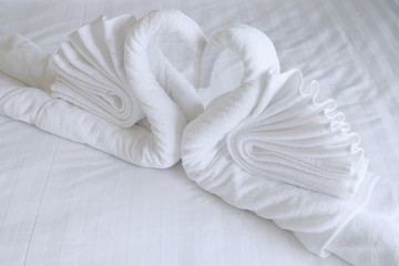 Fototapeta na wymiar Couple swan from a white towel