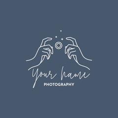 Linear logo of the photographer. Women's Hands hold the camera shutter. Vector logol for a photo Studio