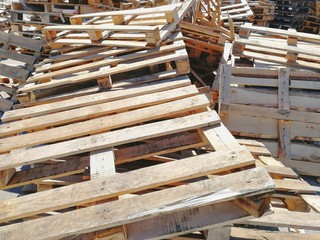 A pile of wooden euro pallets.  Front view.