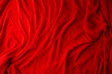 Red cloth waves background texture.