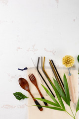 Zero waste kitchen items. Brush for washing dishes, wooden spoon and fork overhead view