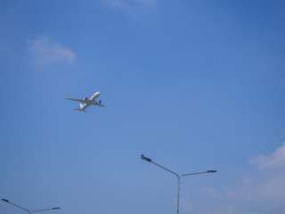 Airplane in the blue sky and cloud for blackground