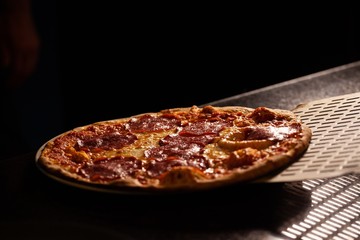 hot pizza with dark background