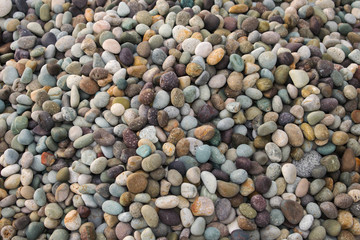 A huge pile of colourful pebble stones or cobble stones. Beach stones